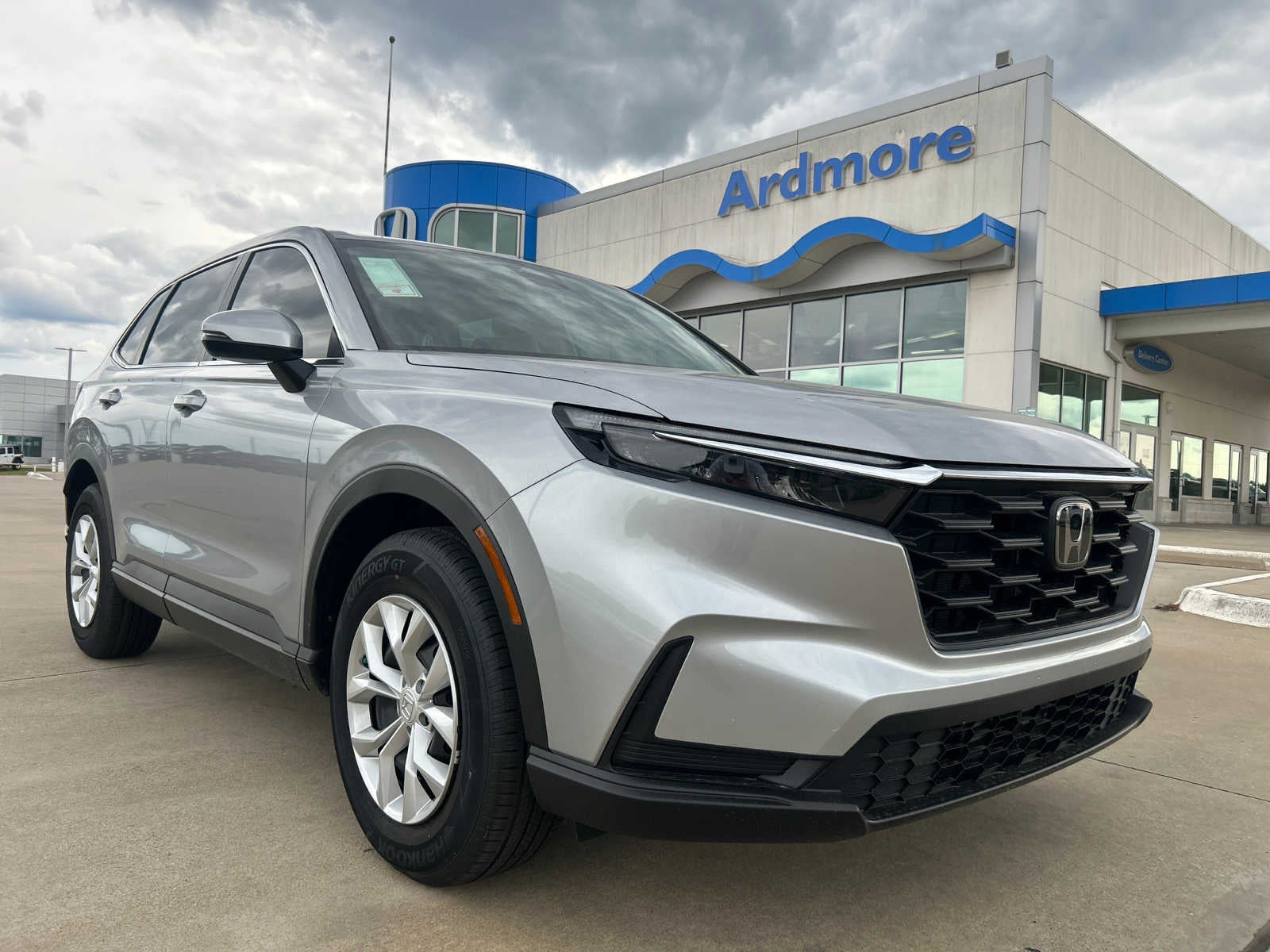 2026 Honda CR-V LX in Solar Silver Metallic — front three-quarter view