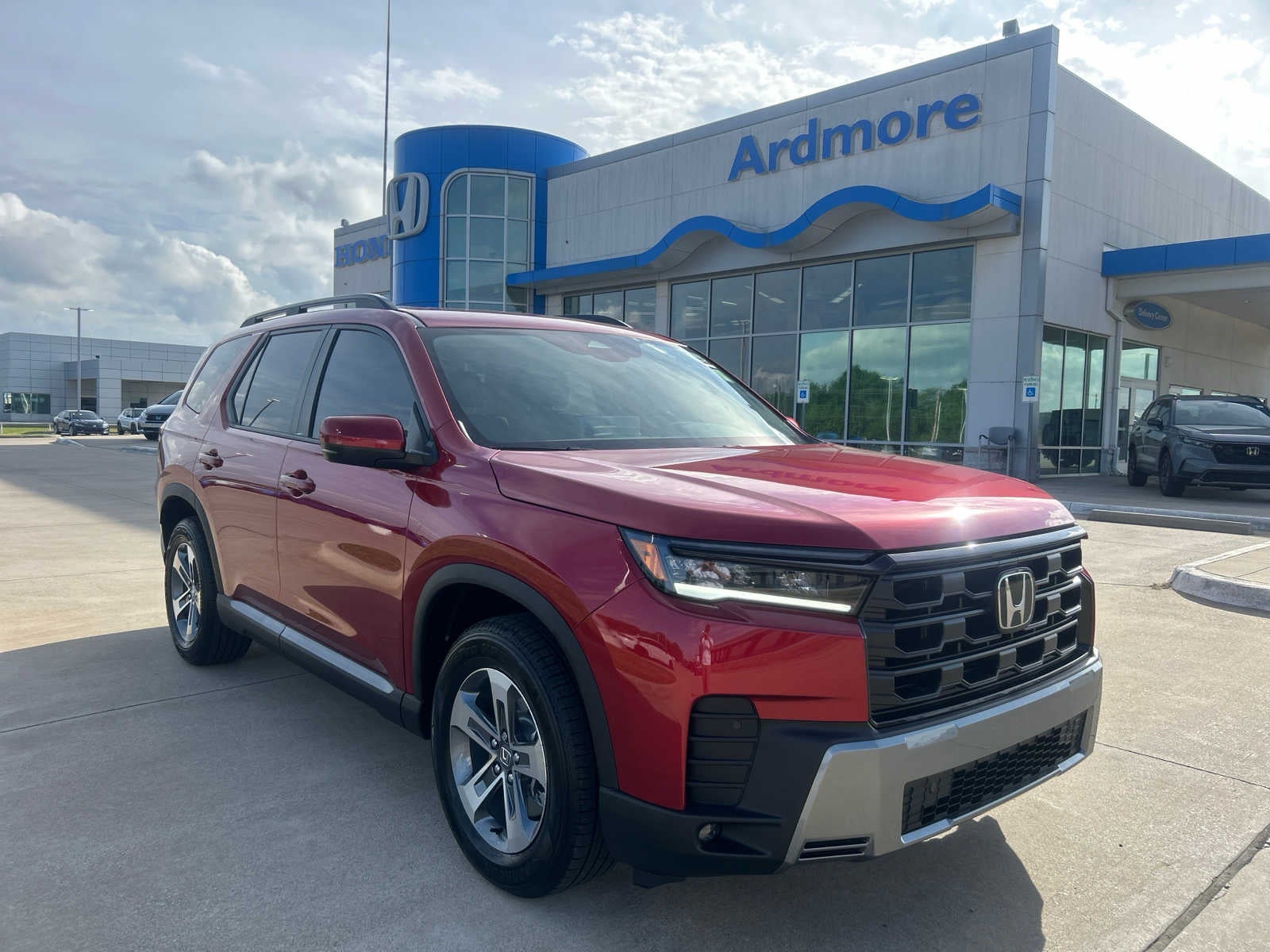 2026 Honda Pilot EX-L in Radiant Red Metallic II — front three-quarter view